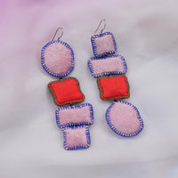 Flat lay of Nirali Blush earrings made in baby pink and red combo.